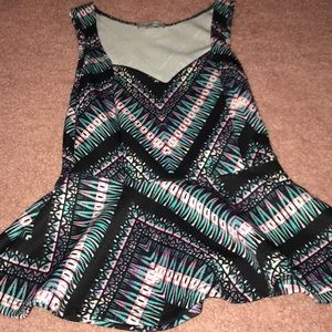 Cute peplum top with fun design!